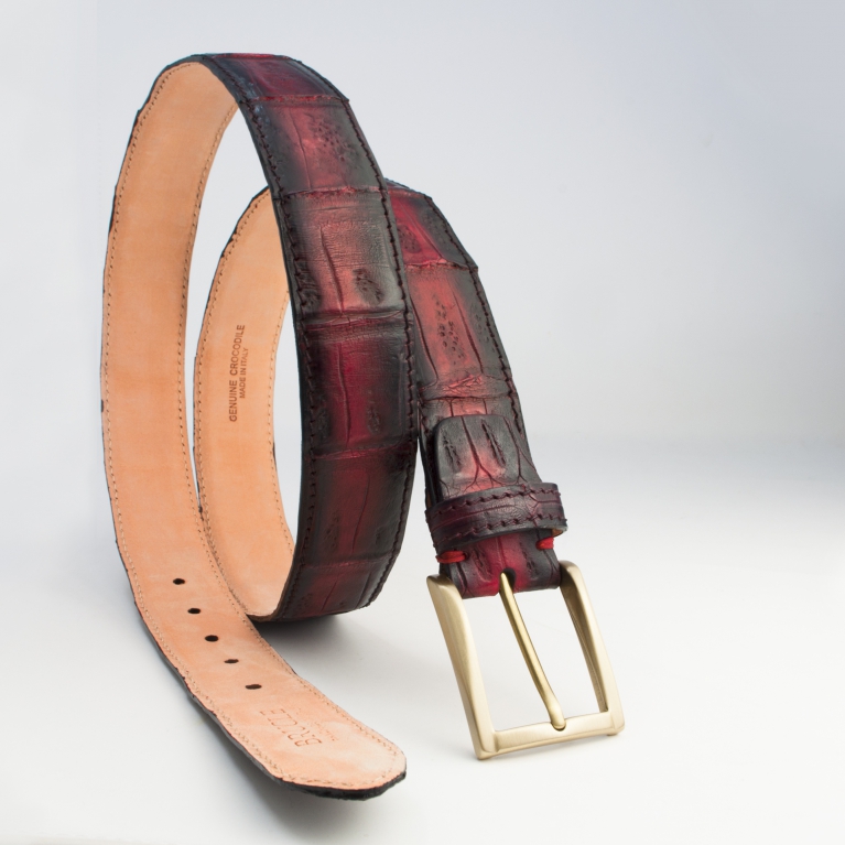 Hand patinated nickel free belt for men and women in crocodile tail, burgundy tones
