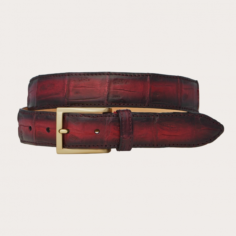 Hand patinated nickel free belt for men and women in crocodile tail, burgundy tones
