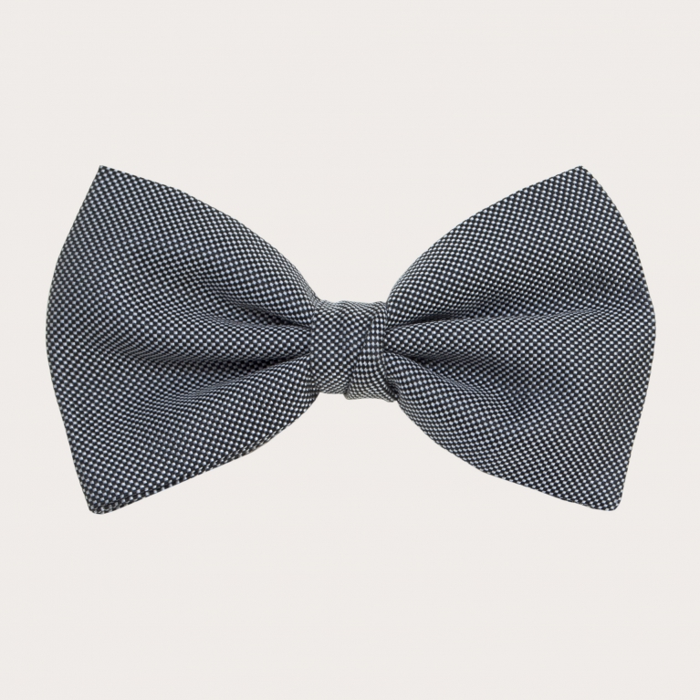 Elegant bow tie in jacquard silk, black and white dotted pattern
