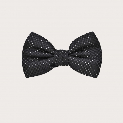 Elegant black bow tie with white polka dots for children