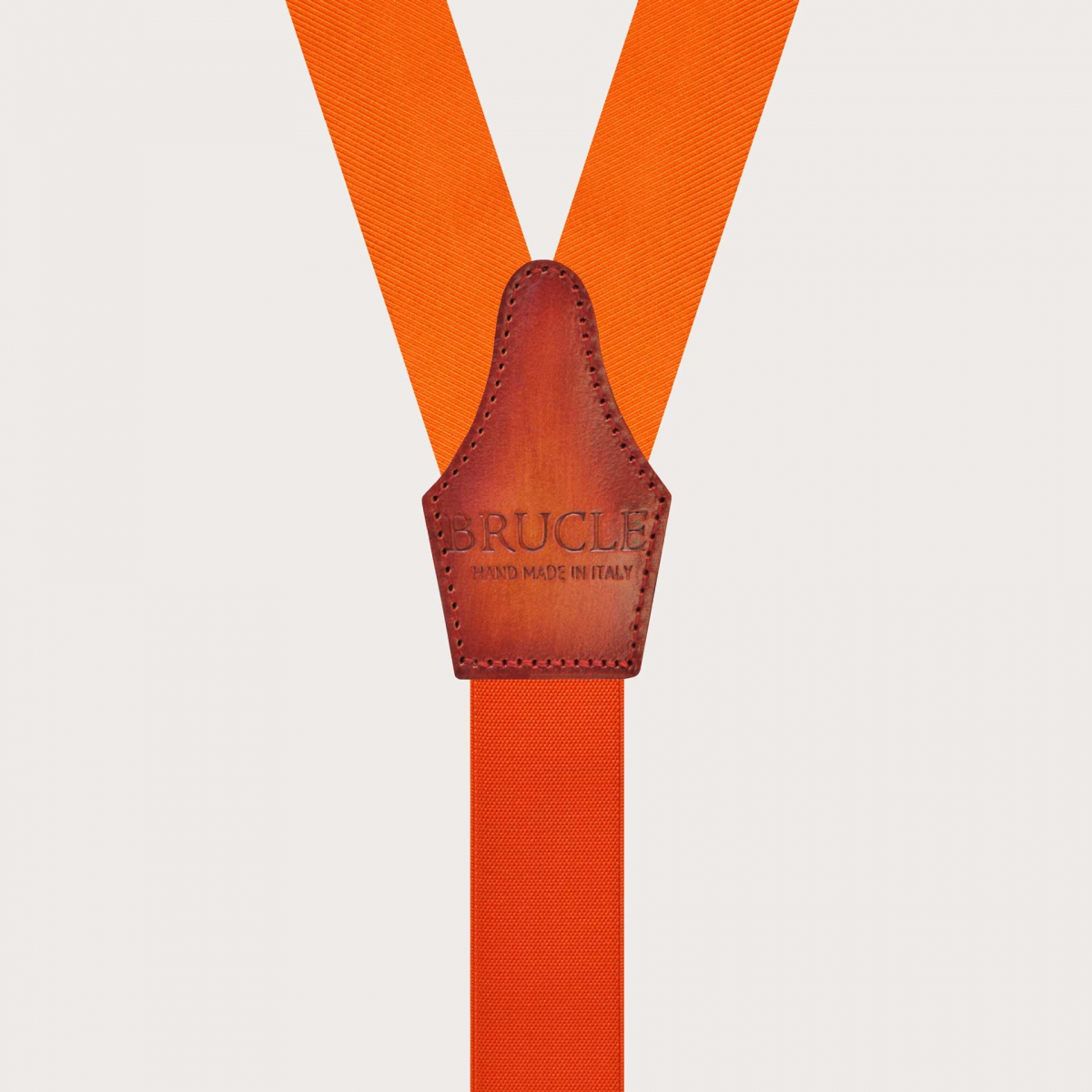 Bretelle arancioni in seta con asole per bottoni e pelle colorata a mano