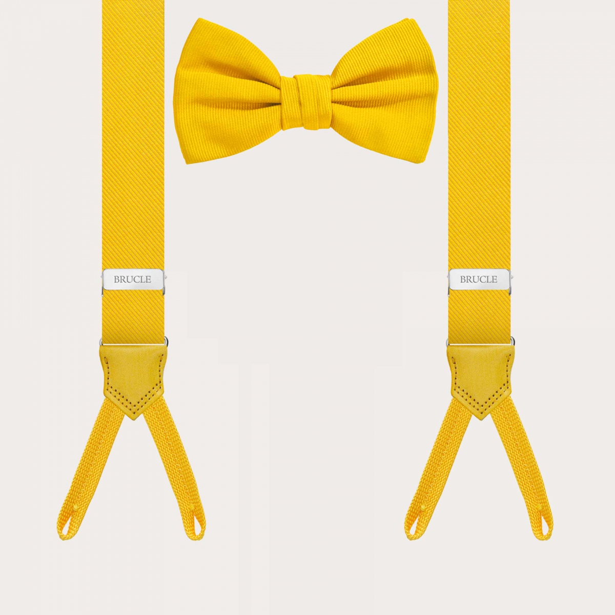 Coordinated yellow set of narrow suspenders for buttons and silk bow tie.