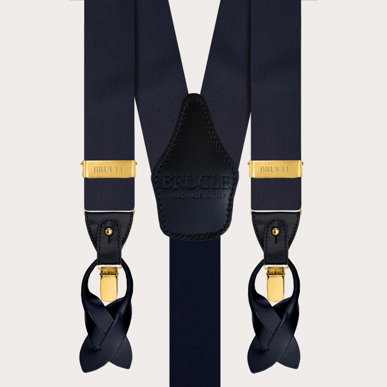 Suspenders with gold clips and coordinated navy blue silk tie