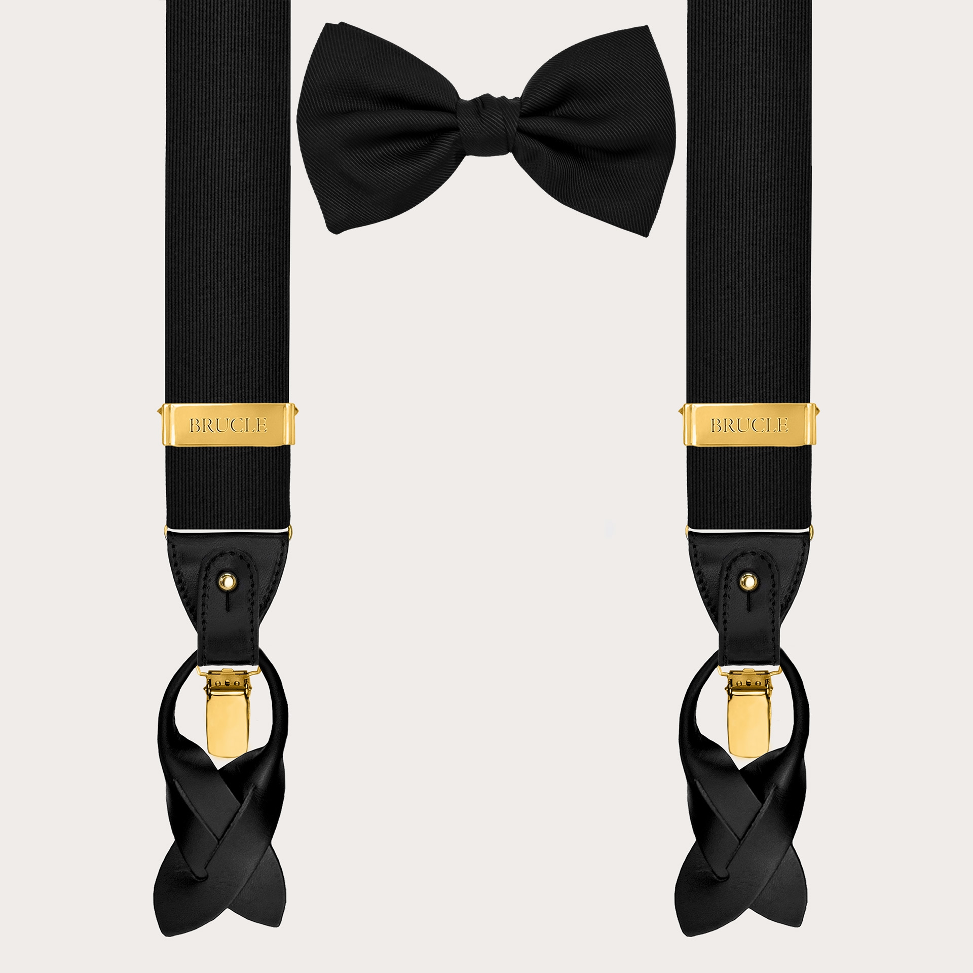 Coordinated set consisting of gold suspenders and black silk bow tie