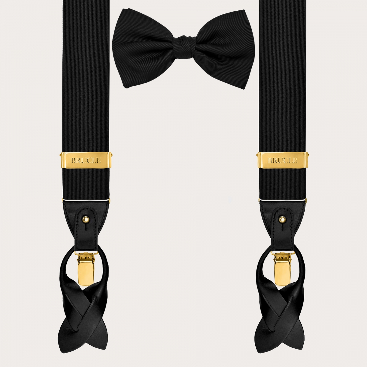 Coordinated set consisting of gold suspenders and black silk bow tie