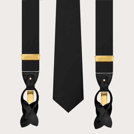 Conjunto con tirantes anchos negros con clips dorados y corbata de tres pliegues en satén de seda brillante