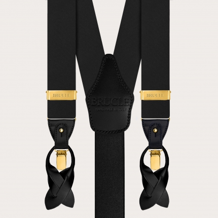 Set with wide black suspenders with gold clips and a three-fold tie in glossy silk satin
